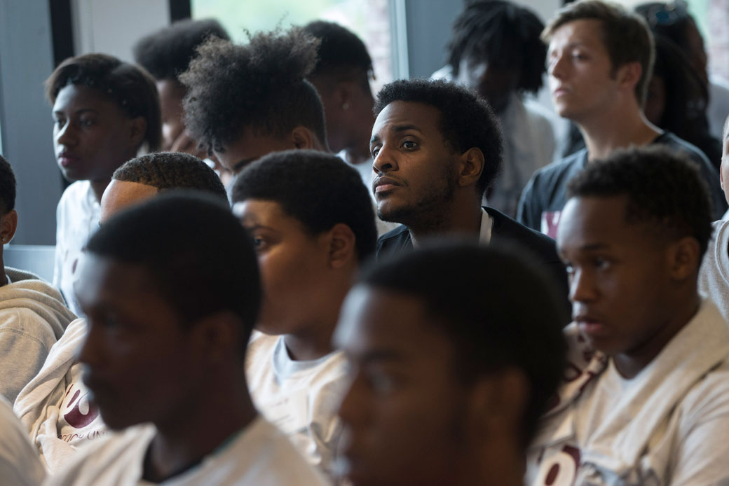 Participants who completed the Youth Options Unlimited summer employment program listen as Boston Mayor Marty Walsh speaks to them in Boston, August 10, 2016. (Getty/The Boston Globe, Keith Bedford)