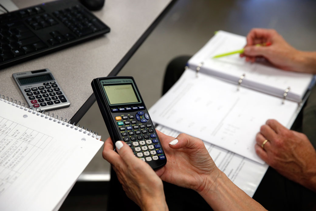 A student uses her calculator during a remedial math class in Haverhill, Massachusetts, June 2015. (Getty/Jessica Rinaldi)