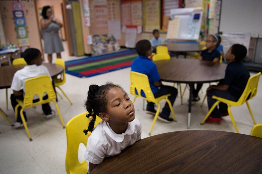 A Baltimore first-grader participates in a morning meditation session with her class, November 2016. (Getty/Linda Davidson)