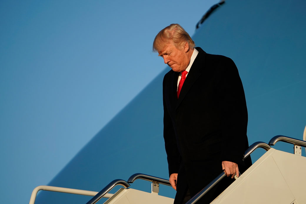 President Donald Trump steps off Air Force One upon return to Andrews Air Force in Maryland,  January 18, 2018. (Mandel Ngan/Getty)