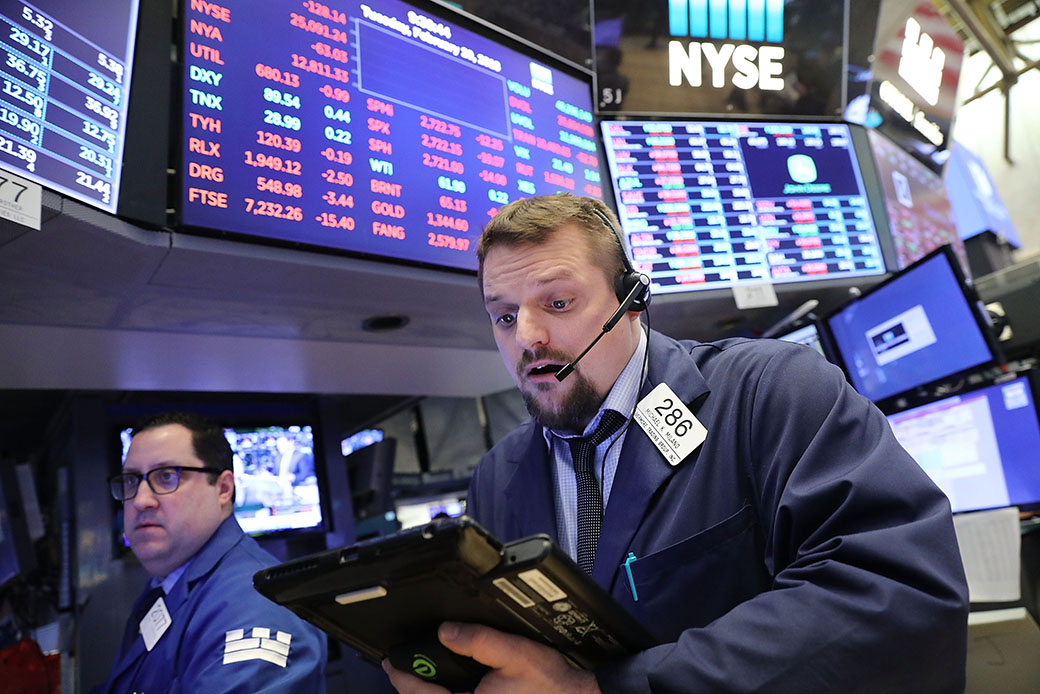 Traders work on the floor of the New York Stock Exchange on February 20, 2018, in New York City. (Getty/Spencer Platt)