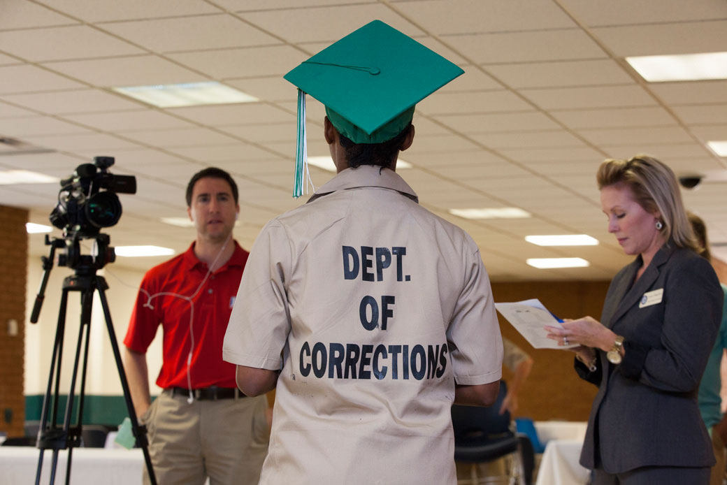 A female inmate who just graduated from high school in prison does an interview for a local TV station in Gainesville, Georgia, July 2015. (Getty/Melanie Stetson Freeman)