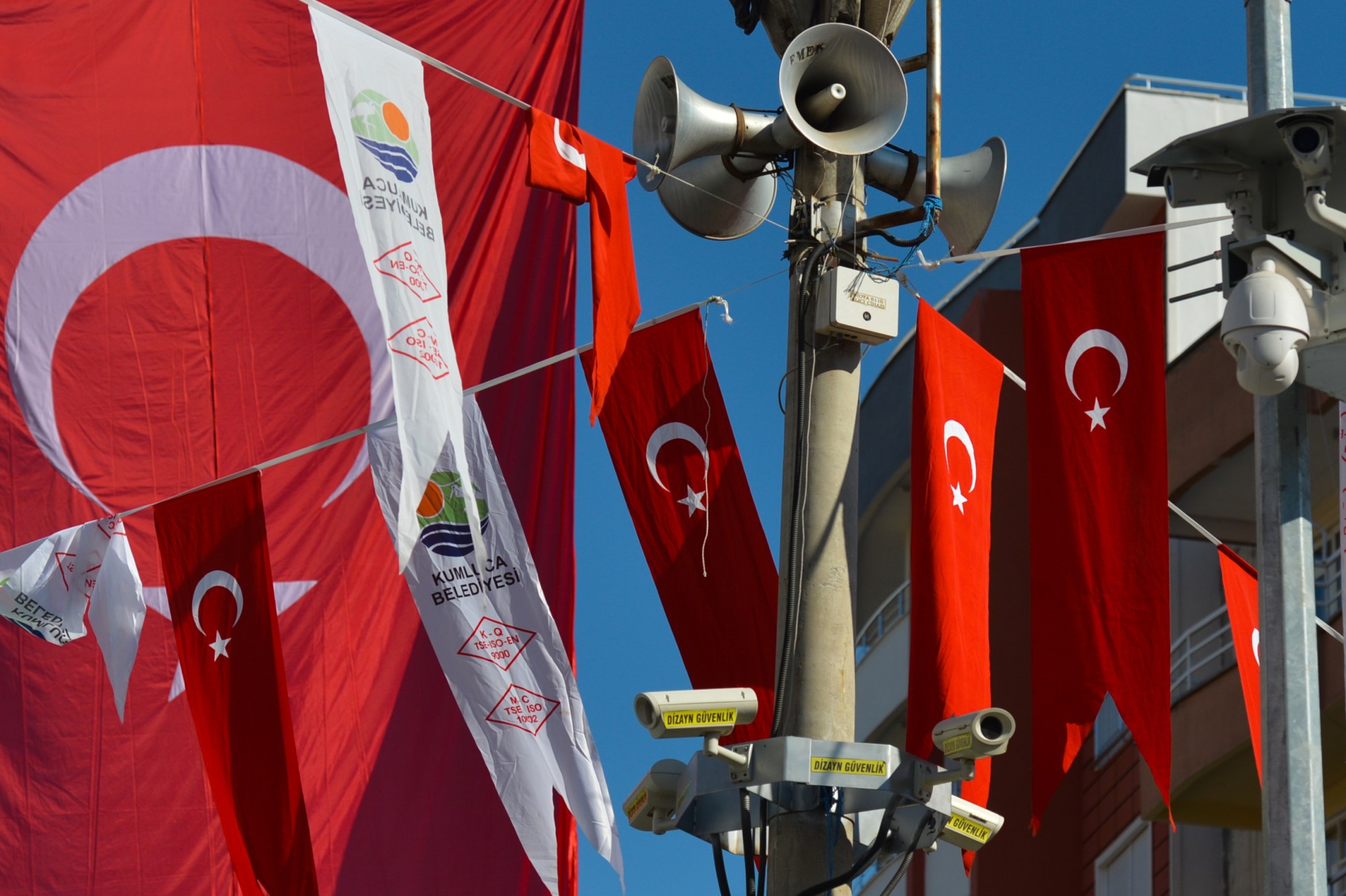 Turkish National flags and CCTV cameras and spikers seen in the main roundabout of Kumluca.
On Wednesday, 11 October 2017, in Kumluka, Turkey. (Photo by Artur Widak/NurPhoto via Getty Images)