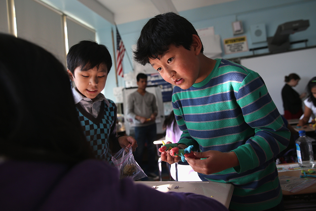 Tibetan immigrant children learn to combine colors with clay during an after-school program for asylum immigrants in New York, April 2013. (Getty/John Moore)