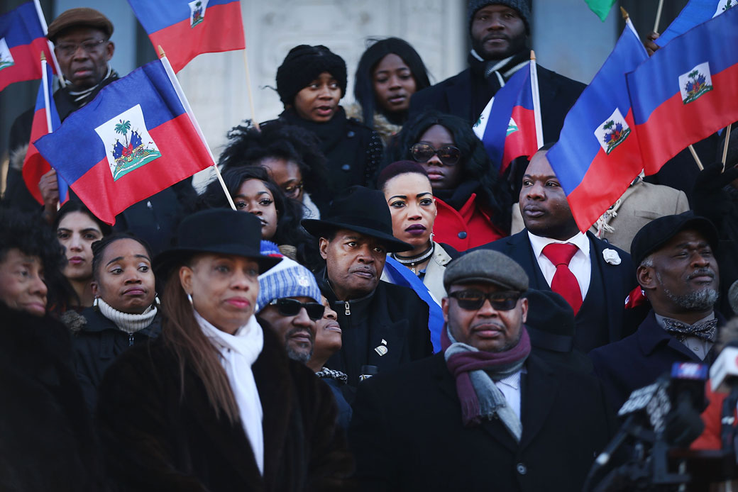 Waving the national flag of Haiti, students, activists, and area politicians attend a unity rally in downtown Newark, New Jersey, in support of immigrants on January 18, 2018. (Getty/Spencer Platt)