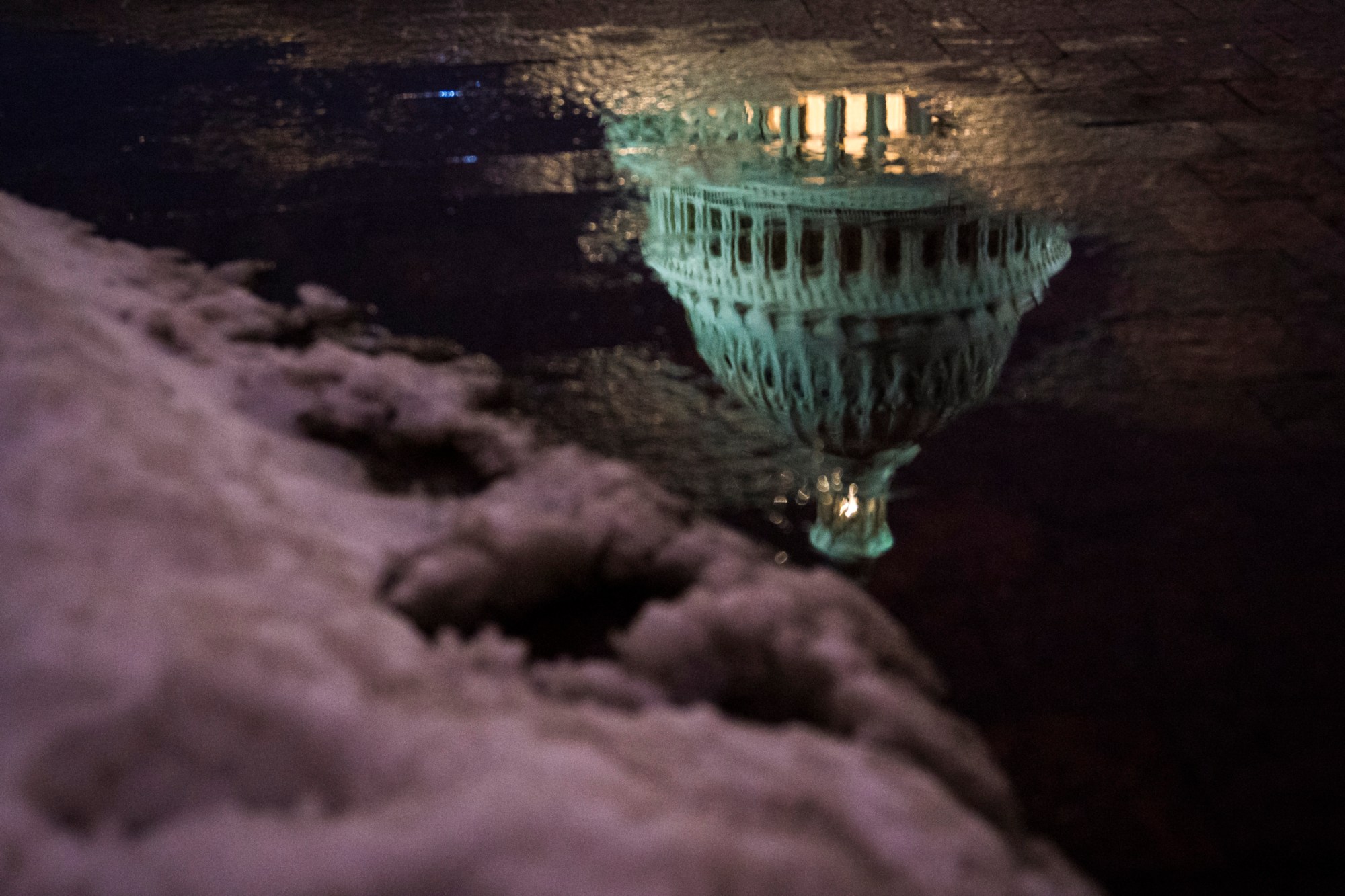WASHINGTON, DC - MARCH 21: A reflection of the US Capitol Building dome is seen as the sun sets after a Spring snow fall on Wednesday, March 21, 2018 in Washington, DC. (Photo by Jabin Botsford/The Washington Post via Getty Images)