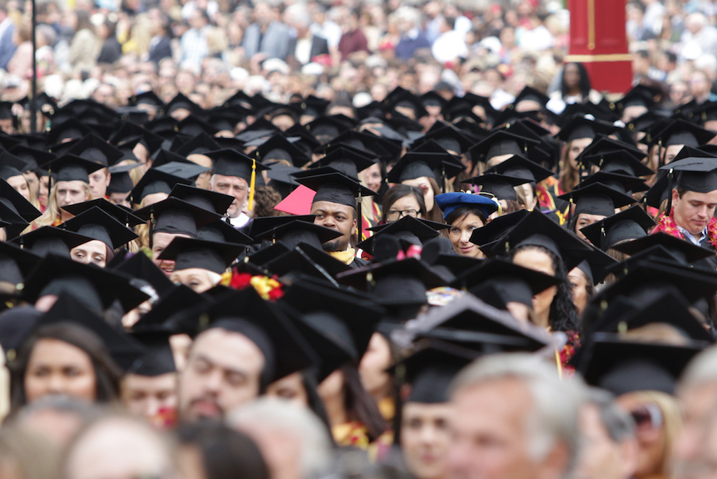 College graduates attend their commencement ceremony in May 2017, Los Angeles, CA. (Getty/Jerritt Clark)