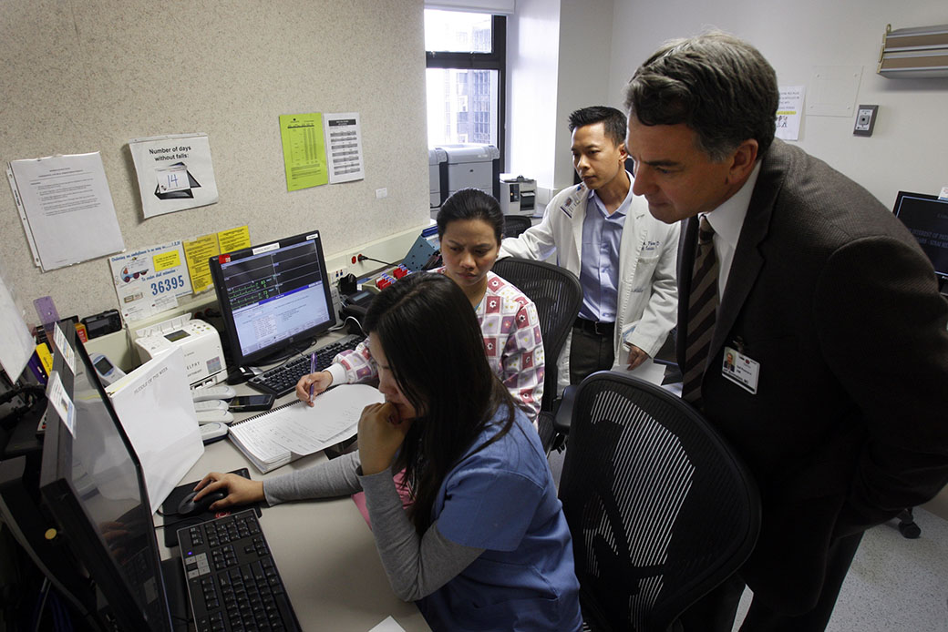 Medical professionals hold a conference regarding a patient, January 2013. (Getty/Los Angeles Times/Allen J. Schaben)