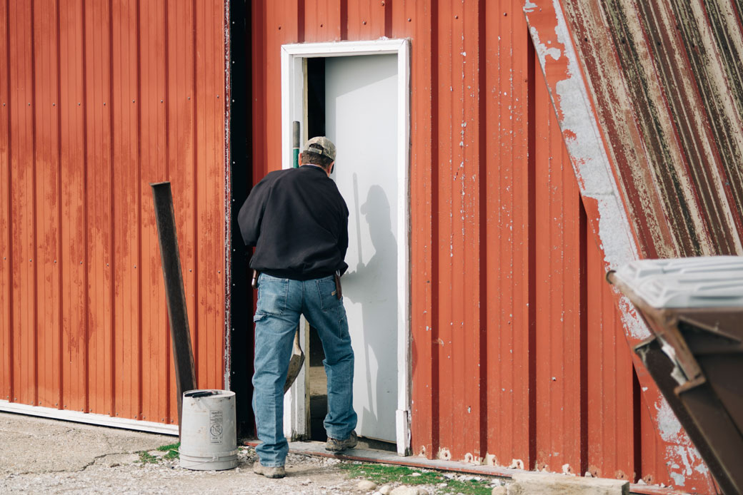 A farmer at a livestock farm in Fillmore, Indiana, on April 6, 2018. (Getty/David Kasnic)