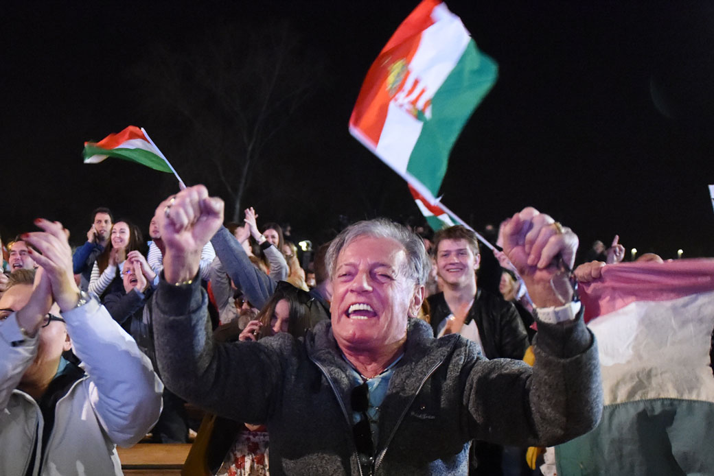 Supporters of the Fidesz party react as Hungarian Prime Minister Viktor Orbán wins the parliamentary election in Budapest, April 8, 2018. (Getty/AFP/Attila Kisbenedek)