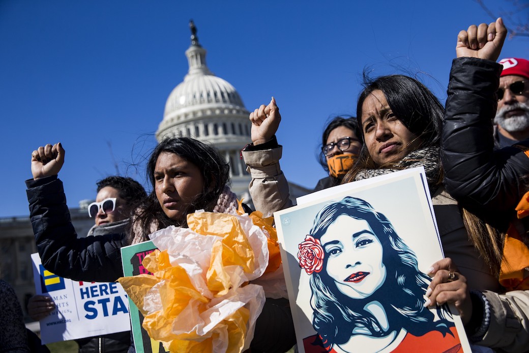 Demonstrators raise their fists to protest President Trump's attempts to end Deferred Action for Childhood Arrivals, Washington, D.C., March 2018. (Getty/Samuel Corum/Anadolu Agency)