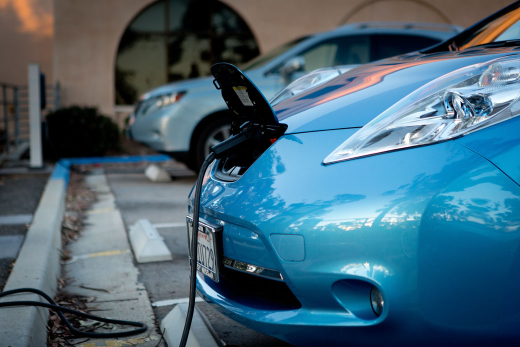 A Nissan Leaf electric vehicle charges at a station in Balboa Park, San Diego, November 2015.