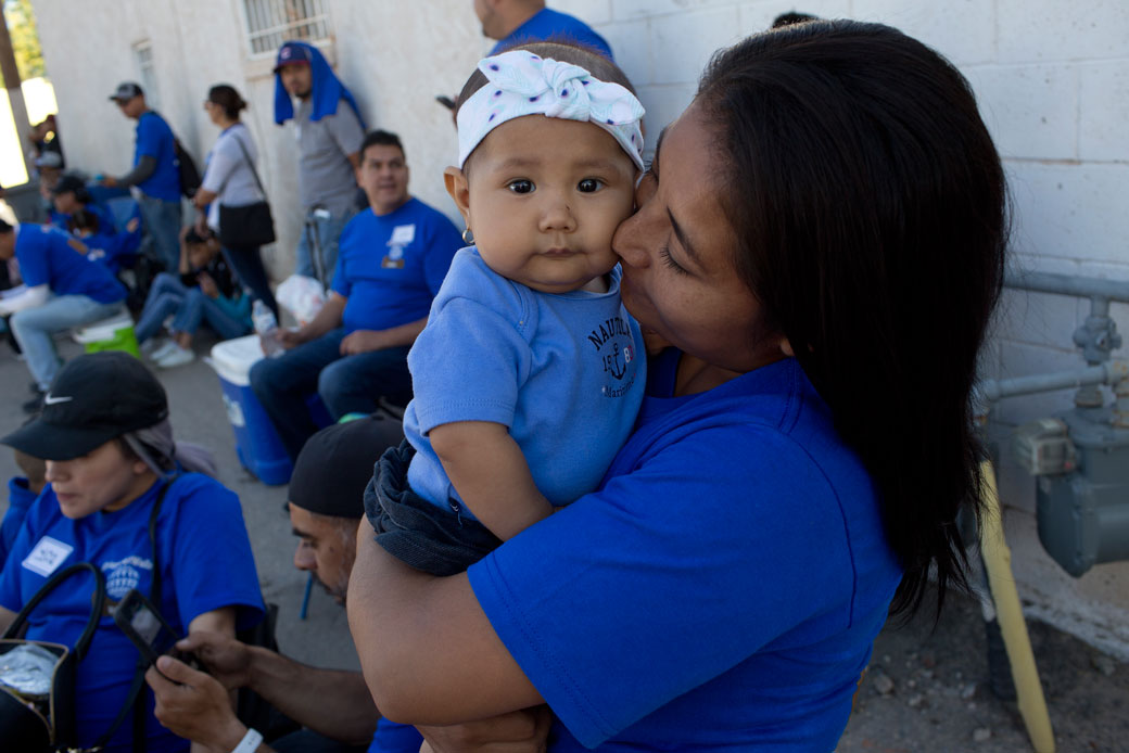 Immigrant families unable to cross into Mexico to visit their relatives because of their immigration status prepare to cross into no-man's land on the U.S.-Mexico border for a brief reunion on May 12, 2018, in El Paso, Texas. (Getty/Corbis/Andrew Lichtenstein)