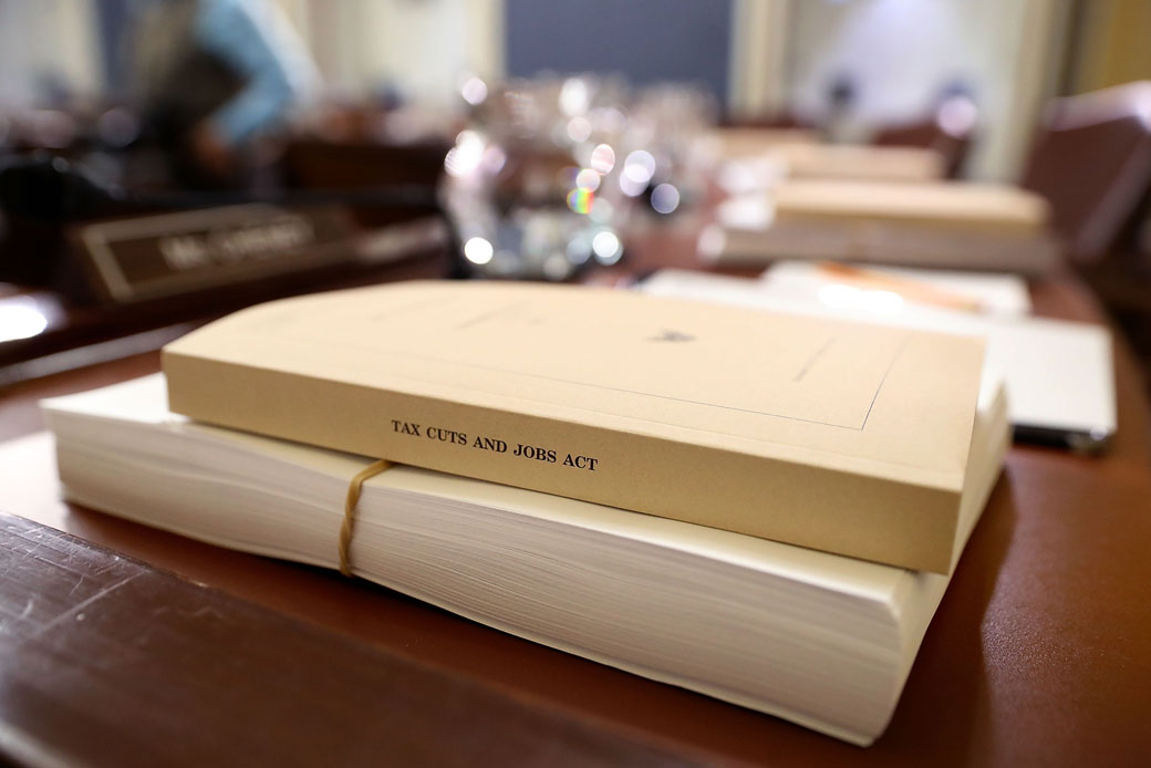 Copies of the conference report for the Tax Cuts and Jobs Act sit on the dais of the U.S. House Committee on Rules in Washington, D.C., December 18, 2017. (Getty/Chip Somodevilla)