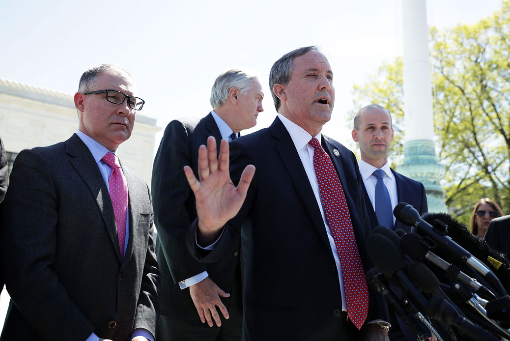 Texas Attorney General Paxton speaks to members of the media in front of the U.S. Supreme Court in Washington, D.C., on April 18, 2016. (Getty/Alex Wong)