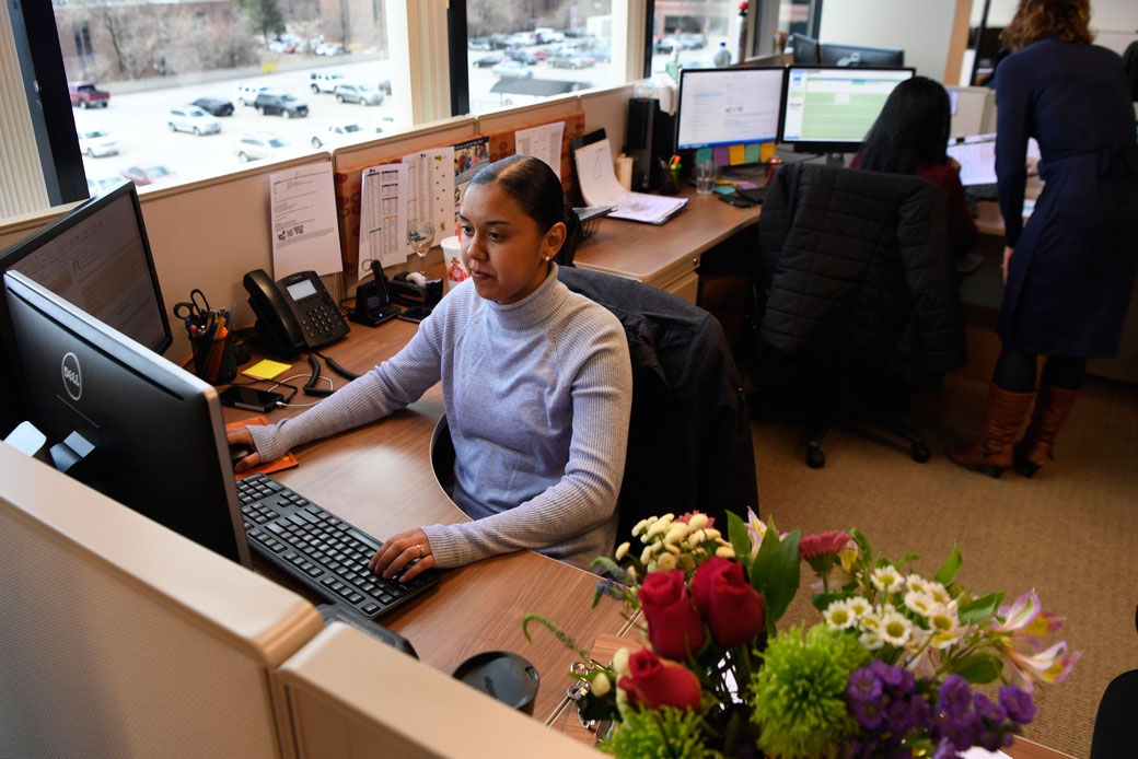 An employee works at her desk in Aurora, Colorado, on March 19, 2017. (Andy Cross/Getty)