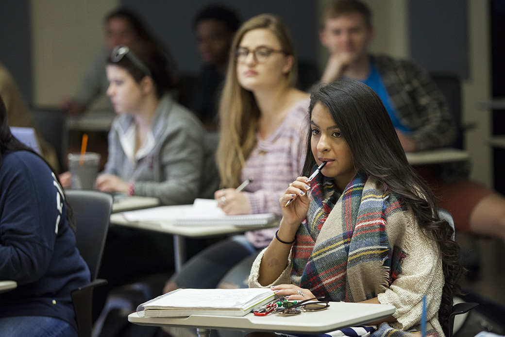 A student takes notes in class, October 2017. (Getty/The Christian Science Monitor/Melanie Stetson Freeman)