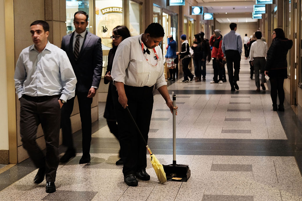 A worker sweeps the floor at Rockefeller Center on May 6, 2016, in New York City. (Spencer Platt/Getty)