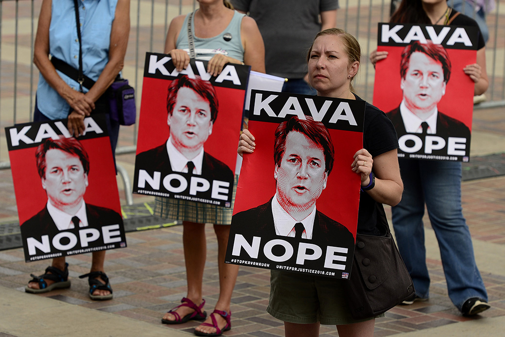 A woman holds up a sign during a rally to protest President Donald Trump's Supreme Court justice nominee Brett Kavanaugh, Denver, August 2018. (Getty/The Denver Post/Helen H. Richardson)