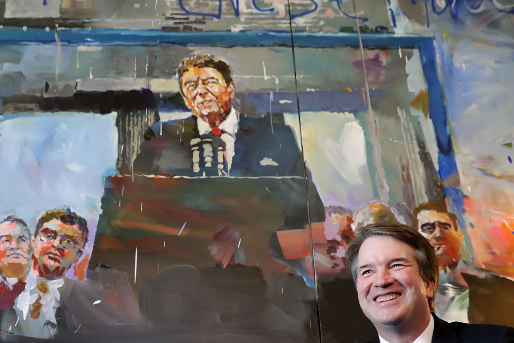 Supreme Court nominee Judge Brett Kavanaugh poses for photographs in front of a painting of President Ronald Reagan, July 17, 2018. (Getty/Chip Somodevilla)