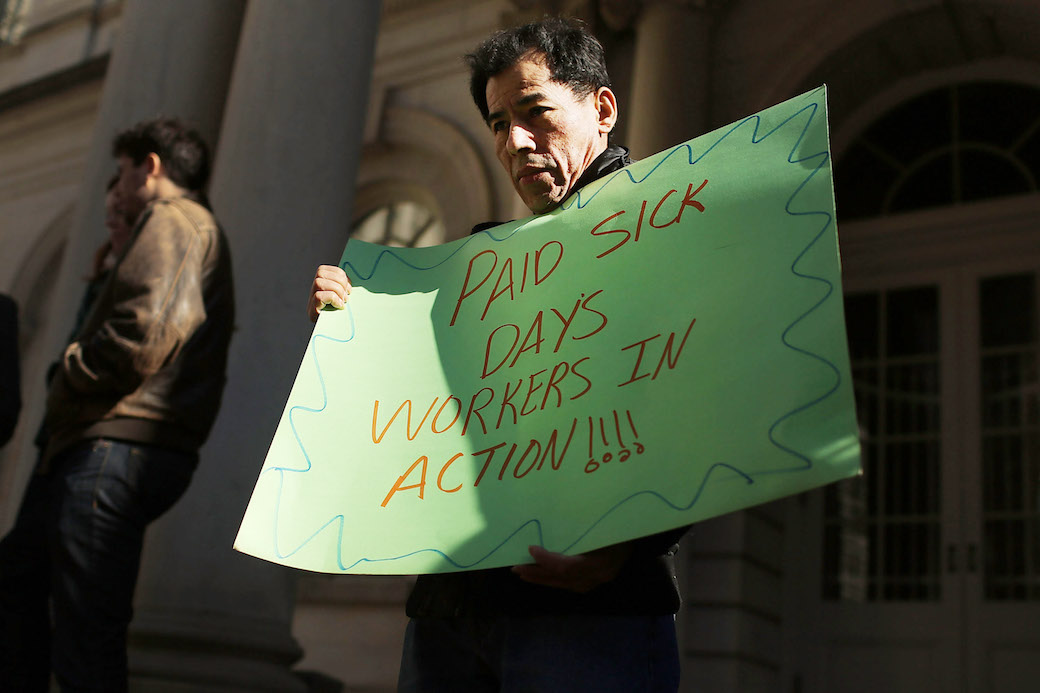 A man attends a rally in New York City to show support for a paid sick leave bill, March 2013. (Getty/Spencer Platt)