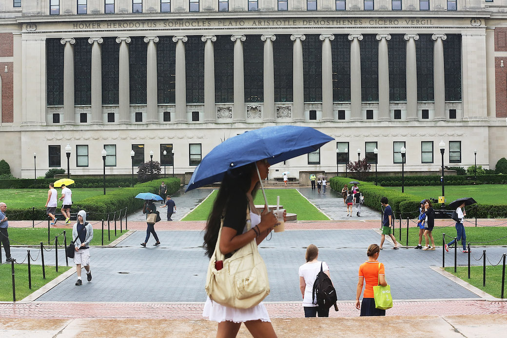Students walk on their university campus in July 2013, New York, NY. (Getty/Mario Tama)