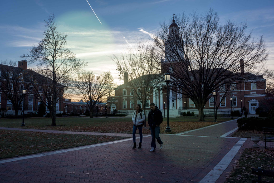 Two students walk on a brick path on a campus, January 2014. (Getty/JHU Sheridan Libraries)