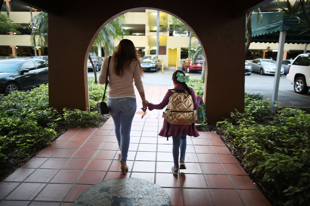 Lorena Jofre, a DACA recipient, walks her daughter to school before driving to work in Miami, Florida, February 2018. (Getty/Joe Raedle)