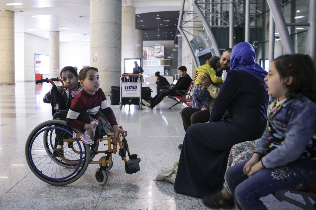 A Palestinian family sits together at an airport on April 17, 2018. (Getty/Dogukan Keskinkilic)