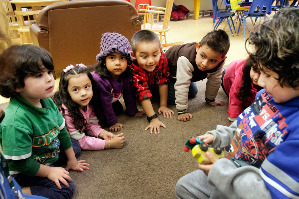 Preschoolers engage in a toy sharing learning exercise at an early childhood education program in Los Angeles, March 2013. (Getty/Los Angeles Times/Lawrence K. Ho)