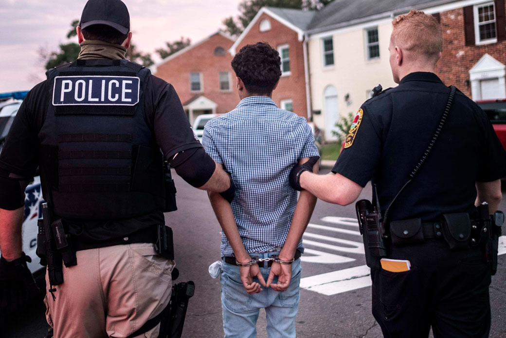 Officers arrest an alleged MS-13 gang member in Manassas, Virginia, on August 10, 2017.