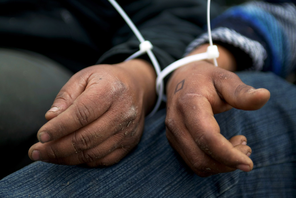 U.S. Customs and Border Protection agents apprehend undocumented immigrants in Campo, CA, March 2006. (Getty/Robert Nickelsberg)