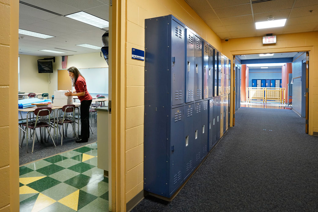 A middle school science teacher sets up her classroom in  Scarborough, Maine, August 2018. (Getty/Portland Press Herald/Gregory Rec)