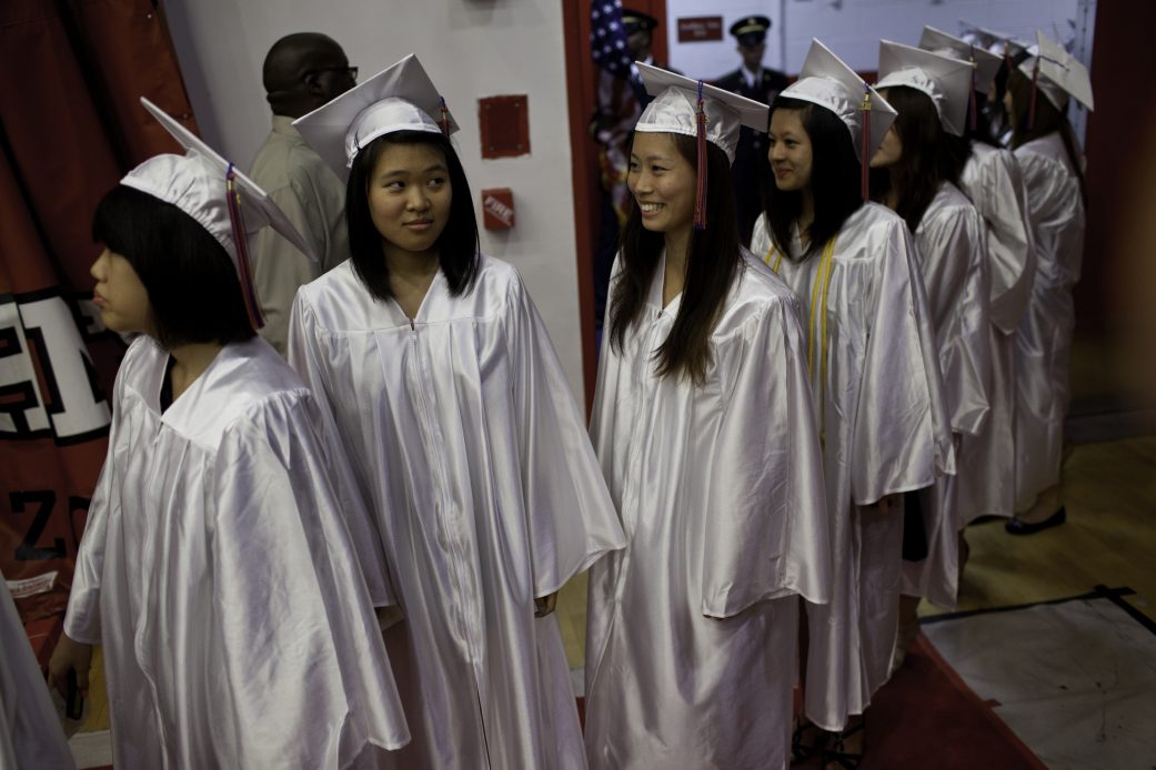 High school seniors walk to their graduation ceremony in New York City. (Getty/Robert Nickelsberg)