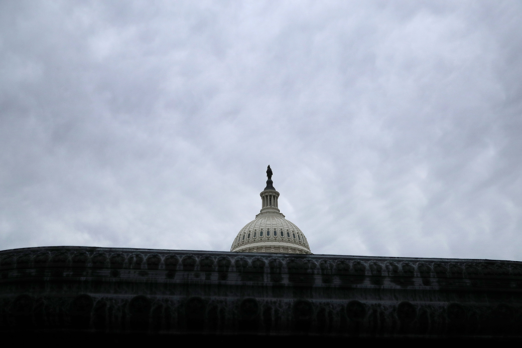 The U.S. Capitol dome stands under a cloudy sky, January 2019. (Getty/Chip Somodevilla)