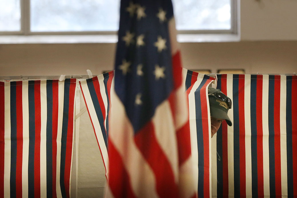 A man exits a voting booth in Bow, New Hampshire, during the state's primary election on February 9, 2016. (Getty/Spencer Platt)