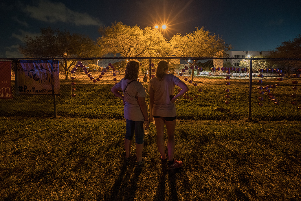 Students view a memorial at Majory Stoneman Douglas High School on February 25, 2018, in Parkland Florida. (Getty/Giles Clarke)