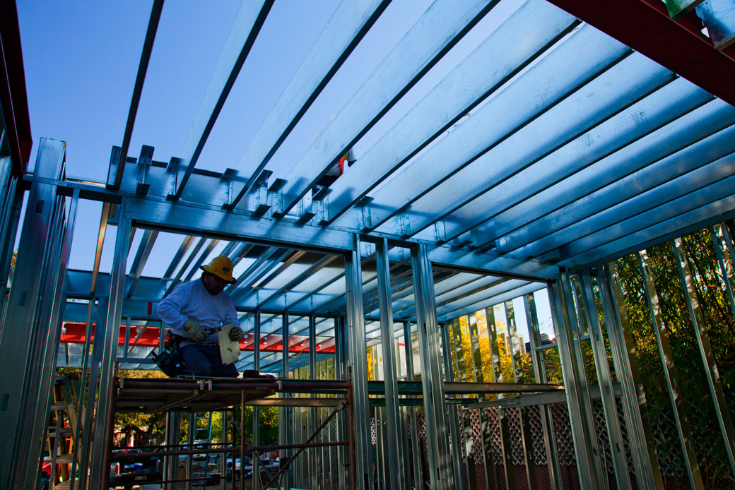 A construction worker assembles steel framing over the foundation of a new, energy-efficient home in Studio City, California, March 2013. (Getty/Education Images/Citizens of the Planet/UIG)