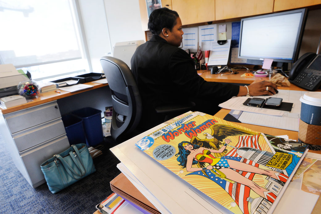 A District of Columbia Public Schools employee sits at her office desk in Washington, January 2011. (Getty/The Washington Post/Matt McClain)