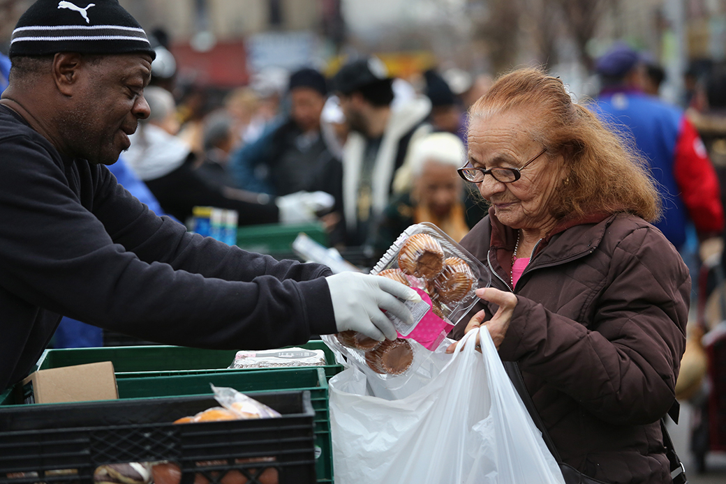 Brooklyn residents receive free food as part of a Christian outreach program, December 2013, in the Brooklyn borough of New York City. (Getty/John Moore)