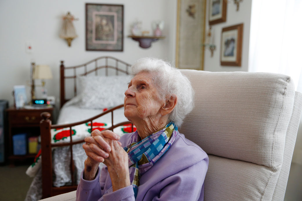 A 92-year-old woman sits inside her apartment in an assisted living residence in Marlborough, Massachusetts, March 2019. (Getty/Jessica Rinaldi)