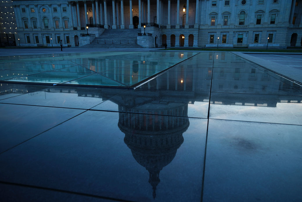 The U.S. Capitol dome is reflected on the plaza of the building's east front in Washington, D.C., April 2019. (Getty/Drew Angerer)