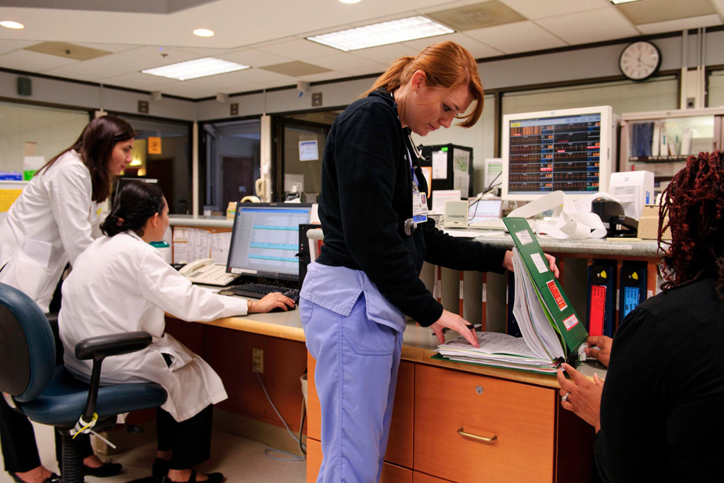 A clinical nurse checks patients' vital signs at a hospital in Washington, D.C., June 2013. (Getty/Maddie Meyer/The Washington Post)