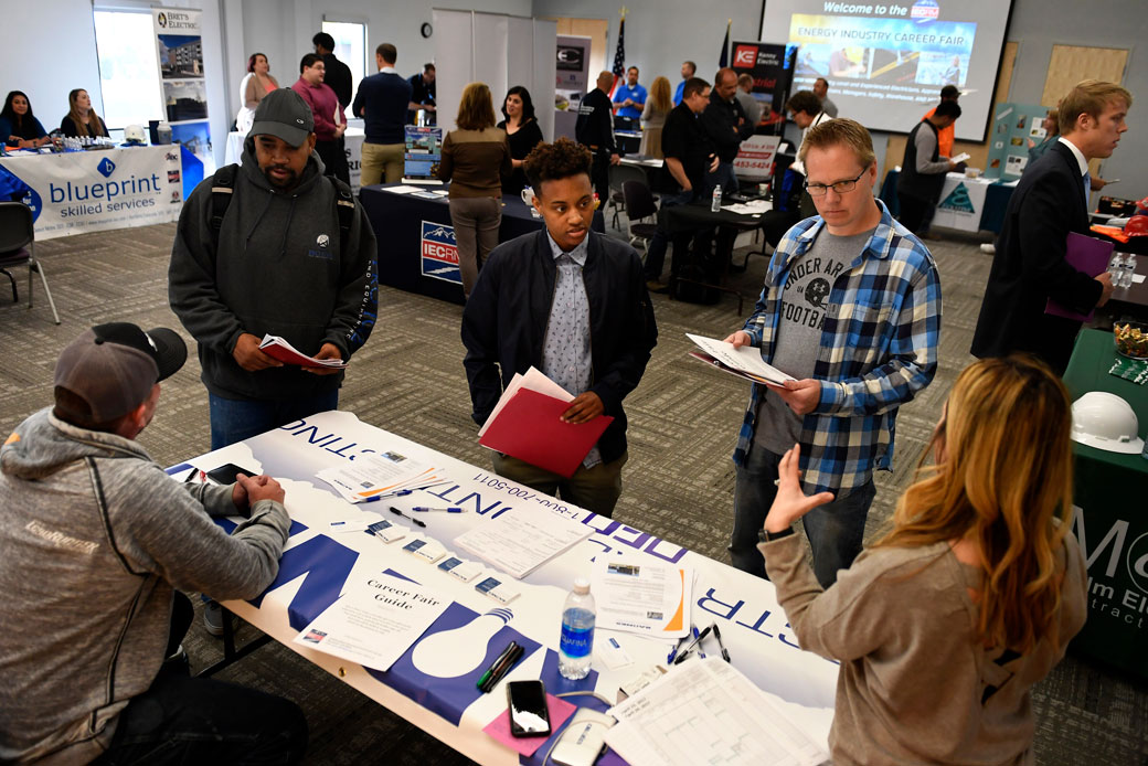 Career fair attendees meet with prospective employers about job opportunities in Northglenn, Colorado, April 2017. (Getty/Joe Amon/The Denver Post)