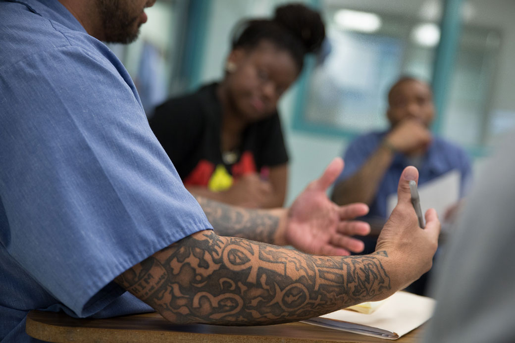 Incarcerated students at Jessup Correctional Institution in Jessup, Maryland, discuss proposals for prison reform with students from Georgetown University, June 2016. (Getty/The Washington Post/Lucian Perkins)