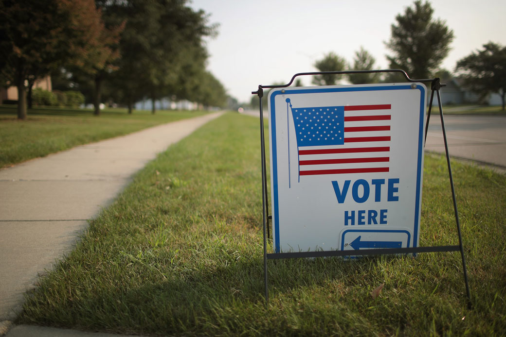 A sign marks the location of a polling place in Janesville, Wisconsin. (Sign marks location of polling place.)
