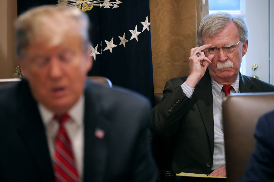 National Security Adviser John Bolton listens to U.S. President Donald Trump, February 2019. (Getty/Chip Somodevilla)