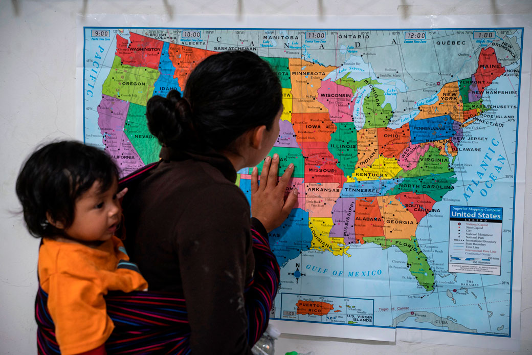 A woman looks at a map of the United States in El Paso, Texas, April 2019. (Getty/Paul Ratje/AFP)