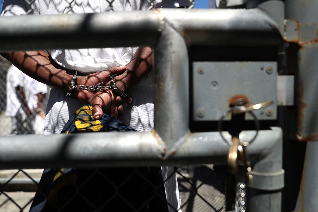 A man stands with handcuffs at the San Quentin State Prison's death row in San Quentin, California, August 2016. (Getty/Justin Sullivan)