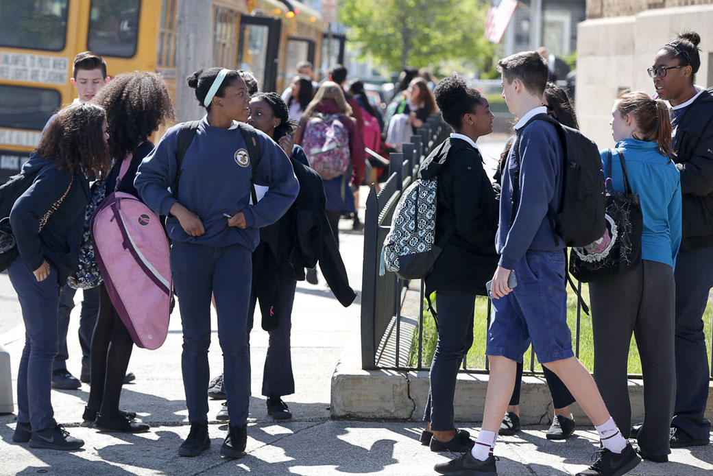 A group of students stands outside their school in Malden, Massachusetts, May 2017. (Getty/Jonathan Wiggs)